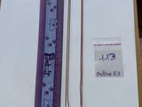 a purple and white bookmark with a chain on top of it
