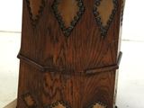 a wooden chair that has a wooden seat on top of it