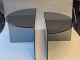 two tables that are sitting side by side on a table