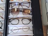 many pairs of glasses on display in a drawer