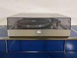 a record player sitting on top of a blue table