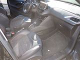 the interior of a car with black leather seats and red trims