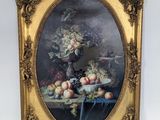 tableau représentant une nature morte composée de fruits et de fleurs, dans un cadre doré