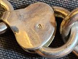 a close up of a metal chain with a lock on it
