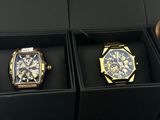 two watches that are in a box on the table