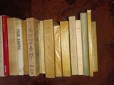 a lot of books that are sitting on a table
