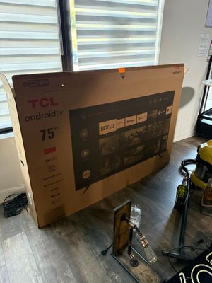a box that is sitting on the floor next to a window