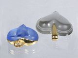 pair of blue and silver earrings with gold accents on a clear surface