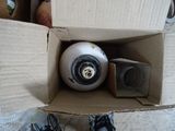 a box with a ball inside of it on the floor