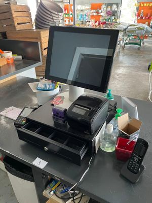 an image of a cash register and a phone on a table