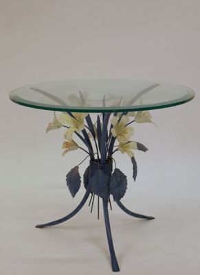 a glass table with flowers on it on a white background