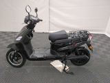 a scooter that is parked on a checkered floor