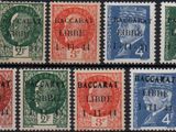 a group of stamps with different colors on them on a black surface