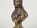 a bronze bust of a woman with a crown on her head