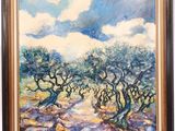 an oil painting of olive trees on display in a glass case