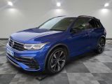 a blue volkswagen suv parked on a checkered floor