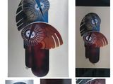 quatre images différentes d'un masque sur lequel est représenté un oiseau