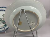 a plate on a stand with a plate holder on it