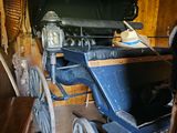 a horse that is standing next to a carriage
