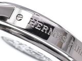 a close up view of a watch with a name engraved on it