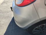 a close up of a car that has been dented