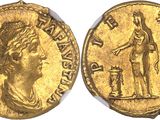 a gold coin with an image of a woman holding a sword
