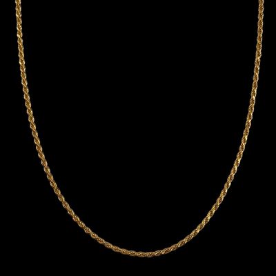 a gold chain necklace on a black background
