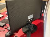 an image of a computer monitor on a red table