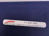 a label on the back of a blue suitcase