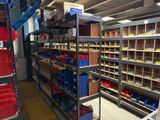 many shelves in the store with many different types of items