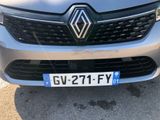 the front of a silver car with a number plate on it