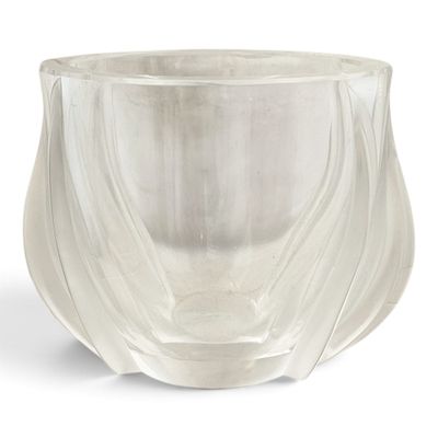 clear glass vase with wavy design on a white background