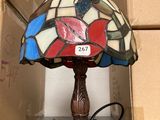a lamp that is sitting on a table next to a box