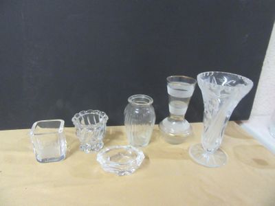 a lot of glass vases sitting on a table