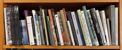 a book shelf with many books on top of it
