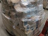 a large stack of boxes sitting on a pallet in a warehouse