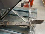 a close up of a chair on a pallet in a warehouse