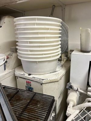 a stack of dishes sitting on top of a washing machine