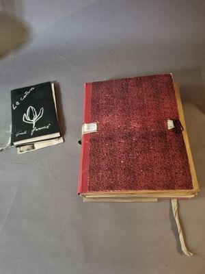 a small book and a small book sitting on a table