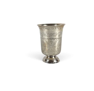 an image of a silver cup sitting on top of a white surface