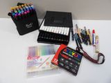 a box of markers, pens, and a case of markers