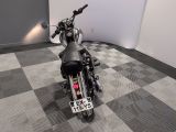 a motorcycle that is parked on a checkered floor
