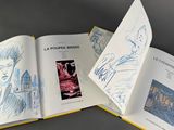 an open book with a drawing of a man and a woman