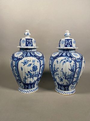 pair of chinese blue and white vases with lids