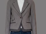 a woman ' s gray jacket and jeans on a mannequin mannequin mannequin mannequin mannequin mannequin mannequin mann