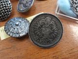 a lot of silver coins on a table next to a card