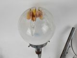 a lamp that has a flower inside of it