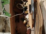 a cardboard box with a bunch of assorted items inside of it