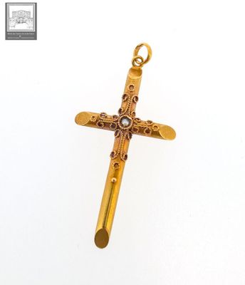 une image représentant une croix en or avec une perle au centre