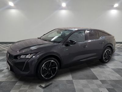 Une Toyota C-HR grise de 2020 est garée sur un sol à damier